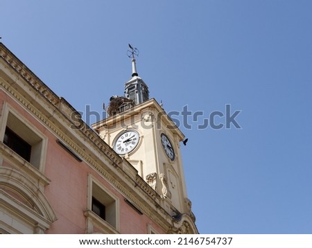 Town Hall of Alcala de Henares with a tower and a clock located in Cervantes Square (Plaza Cervantes). Alcalá is UNESCO World Heritage Site. Photography with copy space