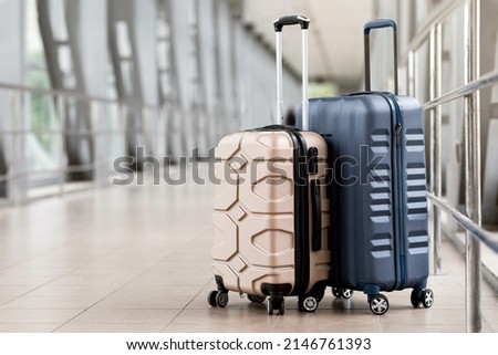 Travel Fashion. Closeup Shot Of Two Plastic Suitcases Standing At Empty Airport Corridor, Stylish Luggage Bags Waiting At Terminal Hall, Banner For Air Travelling And Vacation Booking Concept Royalty-Free Stock Photo #2146761393