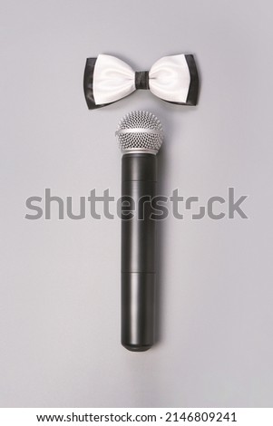 Girl microphone concept. Grey background. Singing artist. Public speaking card. Entertainment podcast person. Event manager. Vertical. Business presentation. For WC. Newcaster
