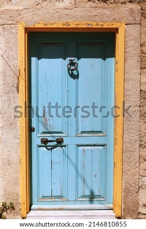 A door is a hinged or otherwise movable barrier that allows ingress (entry) into and egress (exit) from an enclosure.  Royalty-Free Stock Photo #2146810855