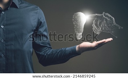 An illustrated hand touches a light bulb. Man holding in his hand
