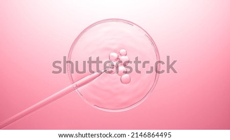 Top view macro shot of air bubbles coming out from lab dropper and floating on the surface of transparent fluid in petri dish bursting on pink background | Abstract cosmetics formulating concept Royalty-Free Stock Photo #2146864495
