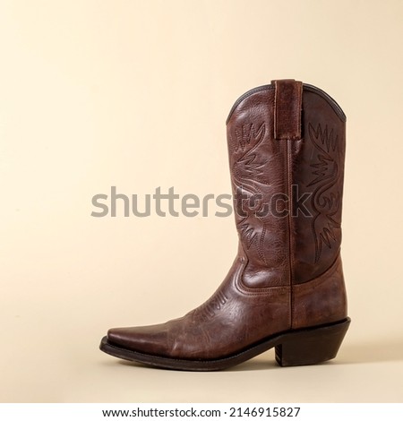Boot cowboy shoe texas america minimal rodeo ranger concept. Royalty-Free Stock Photo #2146915827