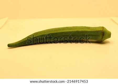 Fresh Okra or Ladies fingers with White and Yellow background