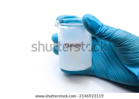 chlorine solution in glass, Chlorine is used to kill bacteria or to perform experiment in laboratory  Royalty-Free Stock Photo #2146923119