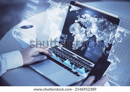 Close up of hand using laptop and smartphone with abstract radar map interface on blurry background. Spy and cyber terrorism concept. Double exposure Royalty-Free Stock Photo #2146952389