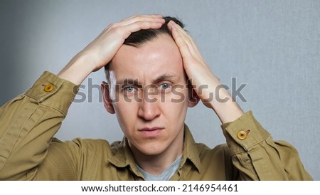 Man with bald spots suffering from hair loss. Treatment of hair problem, closeup Royalty-Free Stock Photo #2146954461