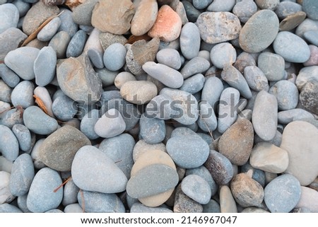 pebbles on the beach. outdoor natural surface in sunset golden hour