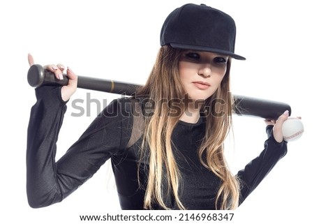 One Winsome Sportive Caucasian Female Baseball Player Athlete Posing With Ball and Bat Wearing Sport Outfit With Cap Against Pure White Background. Horizontal Image