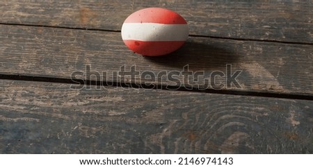 Flag of Austria on a painted egg on a wooden board. Easter in Ukraine. Painted eggs. Easter holiday