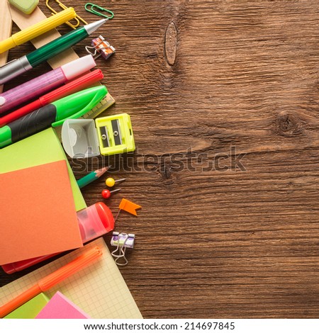 School supplies on a wooden background  