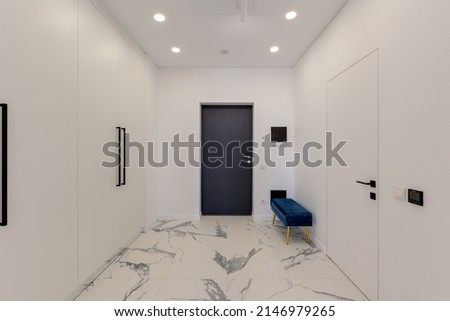 Wide angle view of the entrance to the apartment with white interior and marble floor. High quality photo Royalty-Free Stock Photo #2146979265