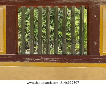Bamboos through a window of bulguksa that is old and famous buddha temple in Gyeongju, Korea. Picture was took from inside of temple. Season was spring. It was sunny day.