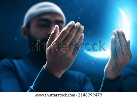 Muslim man praying on night sky moon