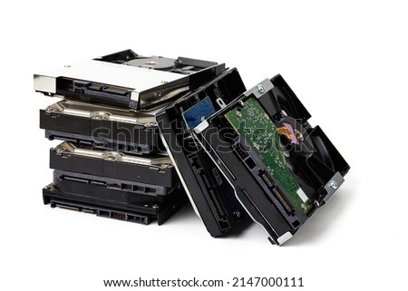 Pile of old hard disk (HDD) for PC are no longer used isolated on white background. 