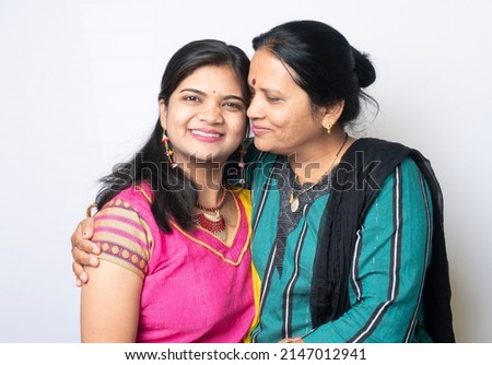 Portrait of indian beautiful mother and daughter.