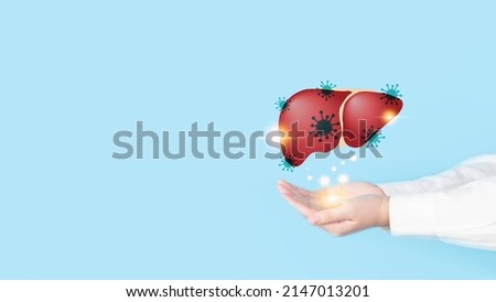 World hepatitis day concept. Doctor hands holding liver with viral infection symbol. Awareness of prevention and treatment viral hepatitis that causes liver cancer. Health care and medical. Royalty-Free Stock Photo #2147013201