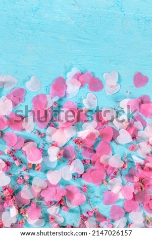 Valentine day or wedding banner with copy space, with pink hearts on a teal background, a design template for a greeting card or invitation