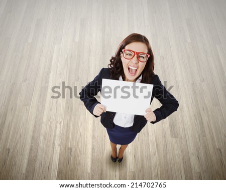 Top view of excited businesswoman holding white blank banner
