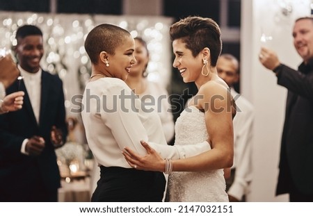Can I have this dance, my love. Shot of a newlywed couple dancing while being surrounded by their guests. Royalty-Free Stock Photo #2147032151