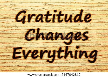 Handwritten motivational message Gratitude Changes Everything burnt on wood. Concept about gratefulness, thankfulness, and appreciation.  Royalty-Free Stock Photo #2147042817