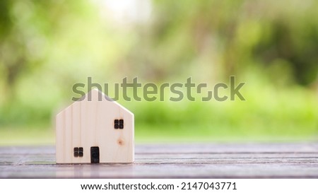 Wooden model house. Concept of real estate investment. planning savings money of coins to buy a home concept for property, mortgage and real estate investment, savings for a house.