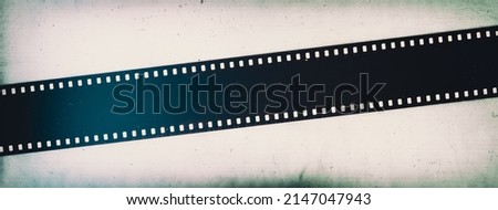 Vintage photography film strip 35 mm close-up, retro background Royalty-Free Stock Photo #2147047943
