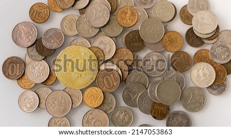 Bitcoin Crypto currency coin virtual money and Russian rubles metal coins.