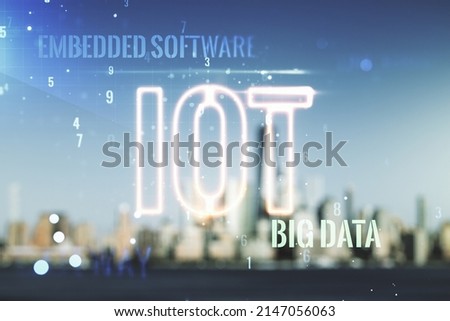 Double exposure of abstract virtual IOT hologram on blurry cityscape background, research and development concept