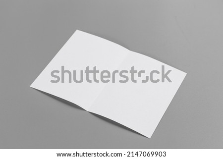 Blank portrait mock-up paper. brochure magazine isolated on gray, changeable background