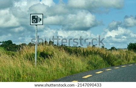 A speed camera on a rural road.     