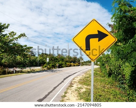 Traffic road sign turn right on empty highway without cars in Dominican Republic, nobody Royalty-Free Stock Photo #2147094805