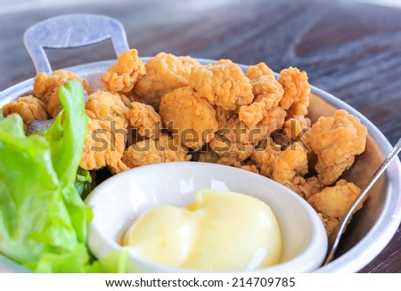 Chicken fry pop with mayonnaise in the pan Royalty-Free Stock Photo #214709785