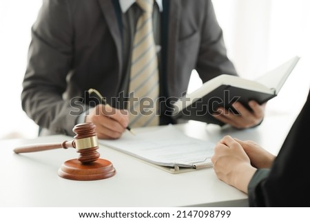 Lawyer lawsuit notary consultation or discussing negotiation legal case with document contract, Consultation of Businesswoman and Male lawyer or judge counselor having team meeting with client.