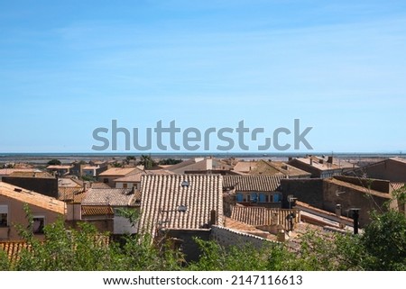 View of the tiled roofs of an old European city on the Mediterranean coast. France.