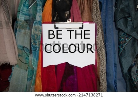BE THE COLOUR with scarves and pink clip board