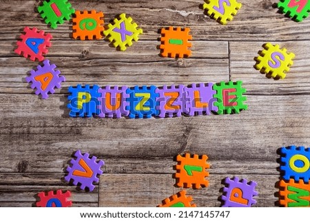 games puzzle for child with wood background. colorful