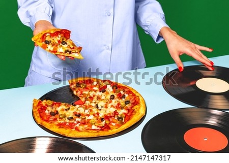 Retro music. Food pop art photography. Female hands with italian pizza lying on vinyl discs on light tablecloth isolated on green background. Vintage, retro style interior. Complementary colors,