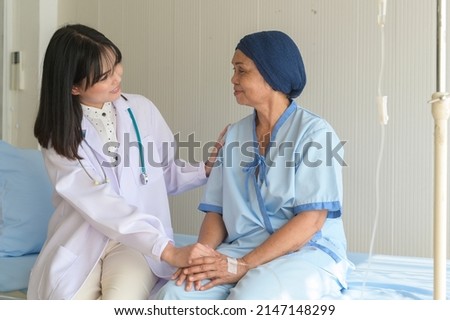 Doctor holding senior cancer patient's hand in hospital, health care and medical concept	
 Royalty-Free Stock Photo #2147148299