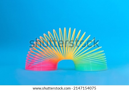Toy plastic colorful rainbow spiral, antistress concept. Royalty-Free Stock Photo #2147154075