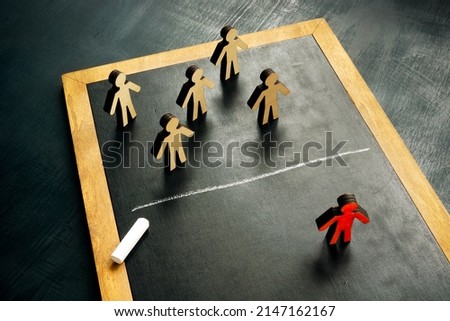Social exclusion concept. Figurines and a chalk line separating them. Royalty-Free Stock Photo #2147162167