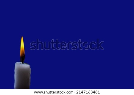 isolate burning candle on dark background .Candle light in darkness as light for life .