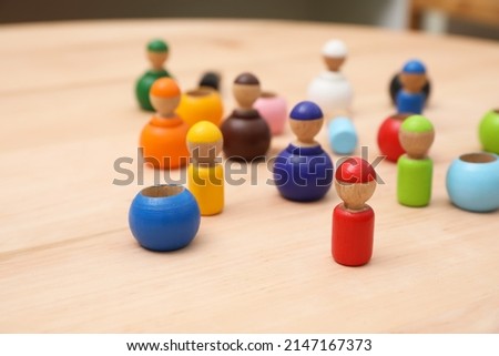 wooden colorful dolls shaped building blocks on table, closeup. Montessori toy Royalty-Free Stock Photo #2147167373