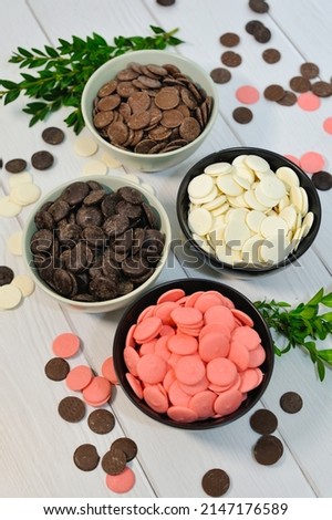Small colored chocolates. Glazed chocolate. Sweet dragee stones. Desserts for Candy Bar. Small multi-colored candies.