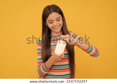 happy child open pill jar. capsule shape tablet for kids. girl hold multivitamin. healthy lifestyle. Royalty-Free Stock Photo #2147192297