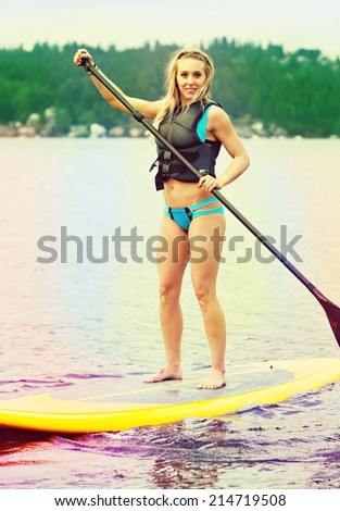 Stand up paddle boarder, filtered image