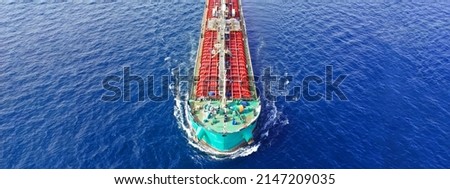 Aerial drone ultra wide panoramic photo of large crude oil tanker cruising open ocean deep blue sea
