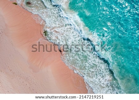 A scenic view with pink sands beach and blue ocean waves of Bermuda Royalty-Free Stock Photo #2147219251