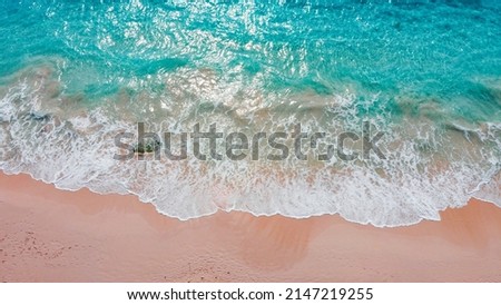 A scenic view with pink sands beach and blue ocean waves of Bermuda Royalty-Free Stock Photo #2147219255