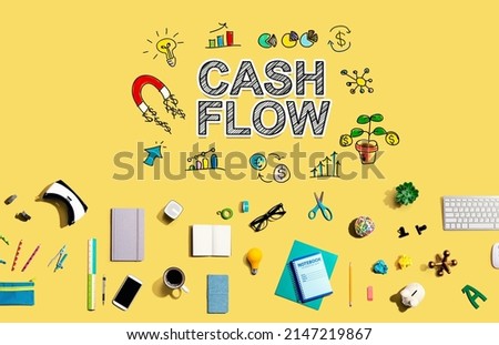 Cash flow with collection of electronic gadgets and office supplies